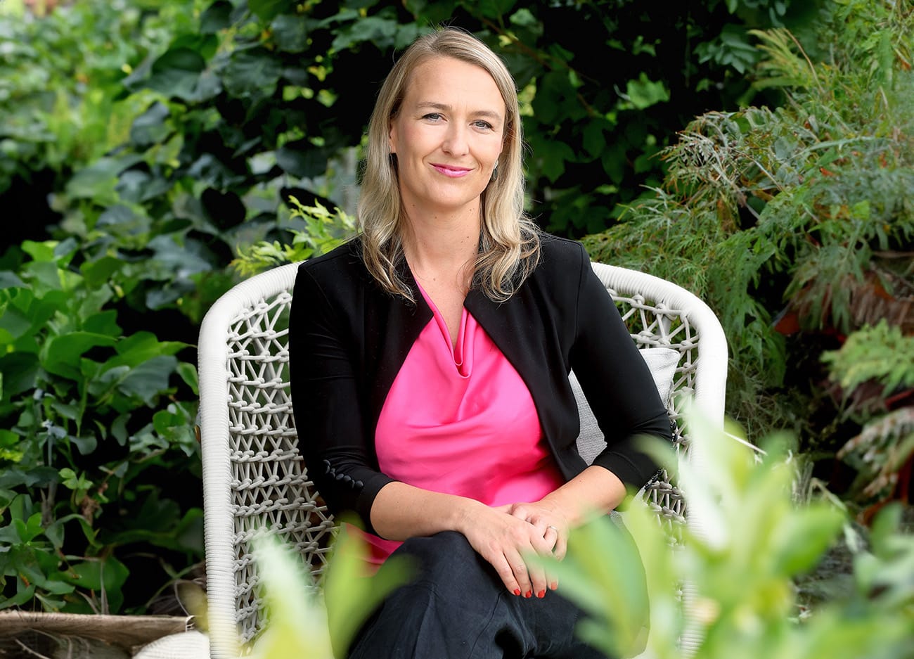 Portrait photo of speaker Andrijana Bergant sitting in a chair in the garden